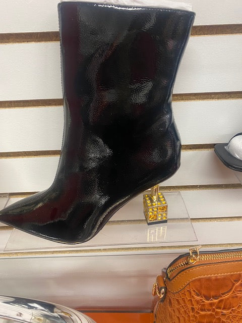 Black pleather boots with a dice heal